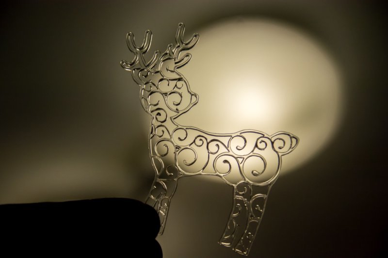 طرح گوزن شمالی طرح گل مناسب برای استفاده در دستگاه های cnc چوب و cnc لیزر - laser cut reindeer swirl ornament cdr file