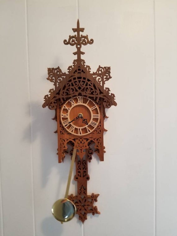 طرح ساعت دیواری چوبی پاندول دار مناسب برای استفاده در دستگاه های cnc چوب و cnc لیزر - laser cut wooden decorative pendulum wall clock template cdr file