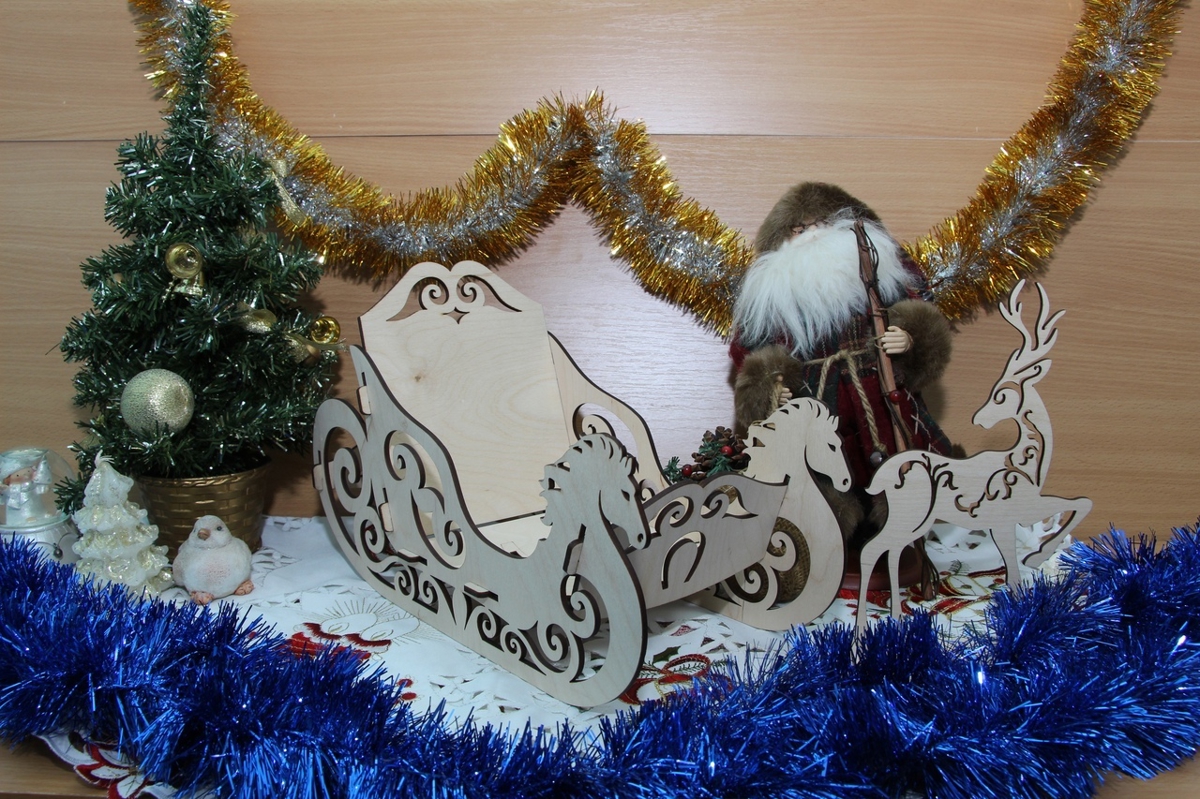 طرح سورتمه کریسمس چوبی و گوزن شمالی مناسب برای استفاده در دستگاه های cnc چوب و cnc لیزر - laser cut wood christmas sleigh and reindeer cdr file