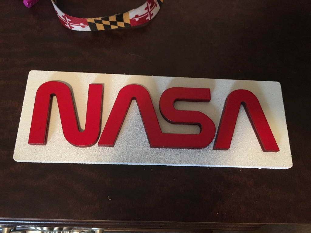 طرح لوگو کرم ناسا مناسب برای استفاده در دستگاه های cnc چوب و cnc لیزر - laser cut nasa worm logo svg file