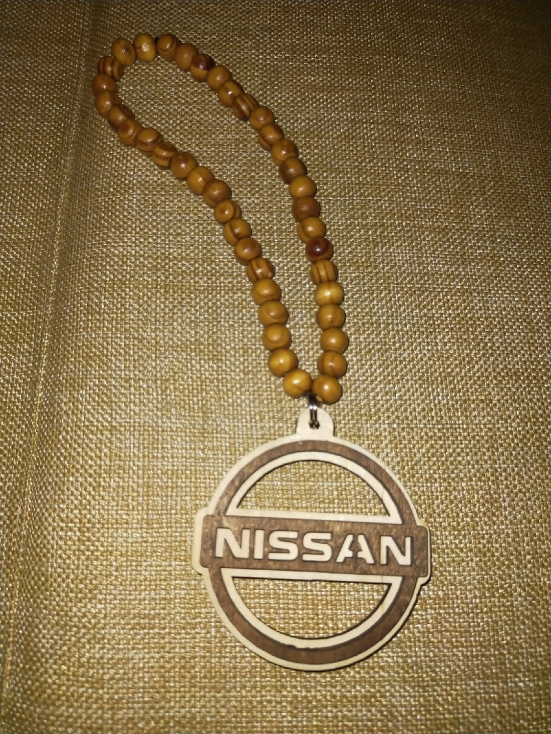 طرح جاکلیدی چوبی نیسان با لوگوی نیسان مناسب برای استفاده در دستگاه های cnc چوب و cnc لیزر - laser cut nissan keychain wooden nissan logo keyring cdr file