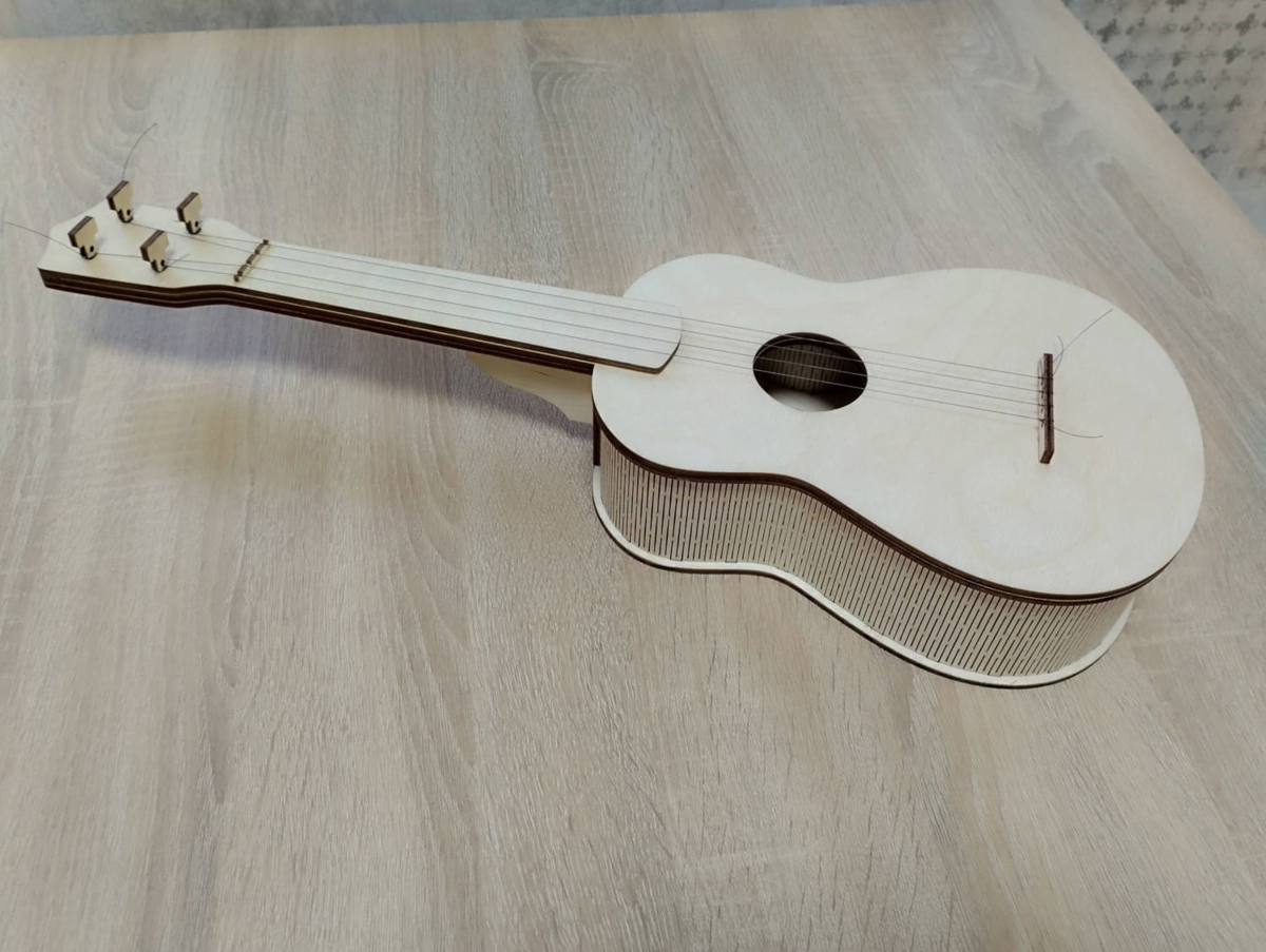 طرح گیتار یوکللی مناسب برای استفاده در دستگاه های cnc چوب و cnc لیزر - laser cut ukulele guitar cdr file