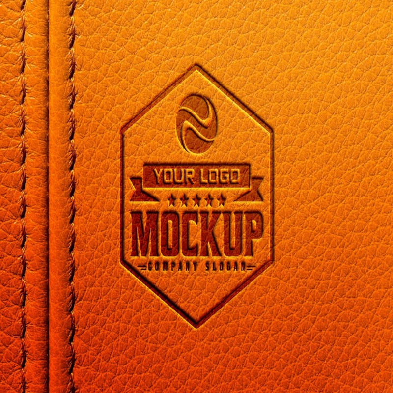 فایل موکاپ لوگو تیره روی زمینه چرم نارنجی - Dark Logo Mockup on Orange Leather Background