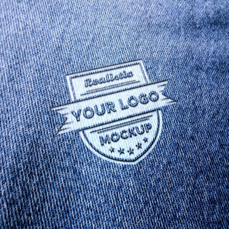 فایل موکاپ لوگو واقع‌گرایانه روی شلوار جین آبی یا پارچه آبی - Realistic logo mockup on blue jeans or blue fabric